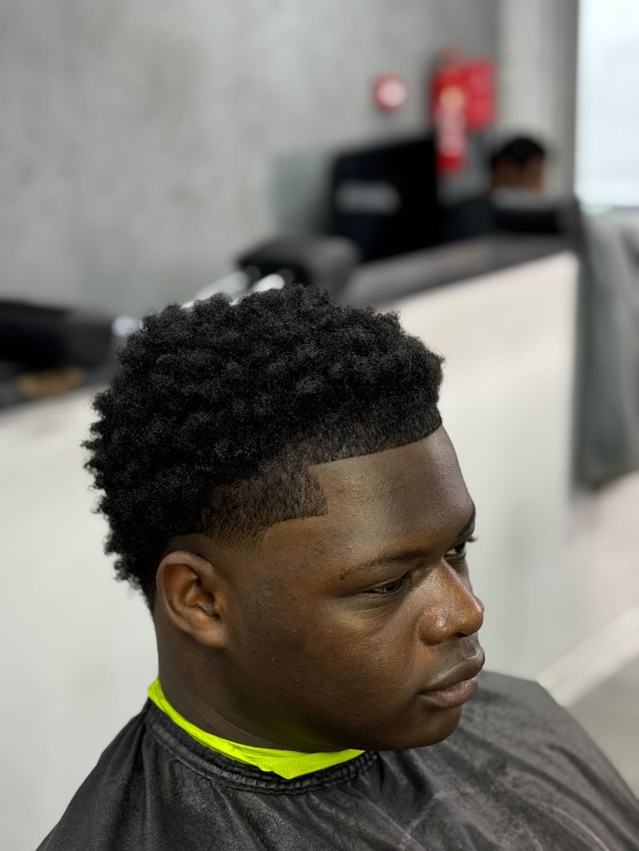Sharp afro skin fade with line-up by Ramz